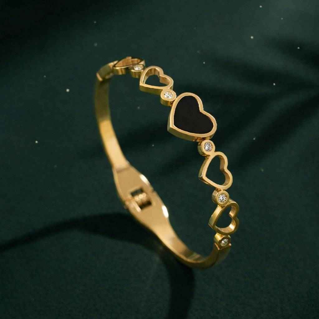 Gold Graduated Heart Bangle with Black Enamel & Crystal Accents